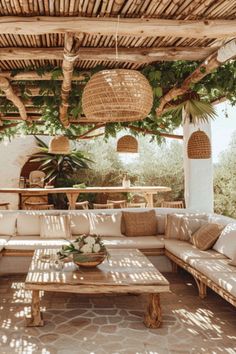 an outdoor living area with wicker furniture