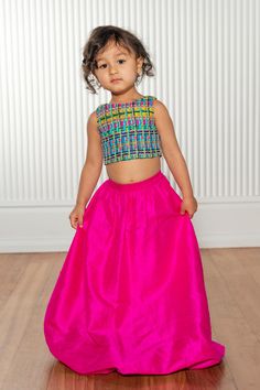 Absolutely adorable kid's lehenga skirt designed with a bubbled hem and an elastic waistband. Paired with KYLA Tweed Kids Lehenga Top Details Raw Silk Hand wash or Machine Wash Cold, Flat Dry Item #104905 Ethically produced + designed in NYC Pink Tiered Skirt Dress For Festive Occasions, Pink Festive Tiered Skirt Dress, Pink Festive Dress With Tiered Skirt, Festive Pink Sets With Tiered Skirt, Festive Pink Tiered Skirt Sets, Festive Long Skirt Sets For Spring, Festive Spring Sets With Long Skirt, Fitted Multicolor Skirt For Navratri, Pink Skirt For Party And Navratri