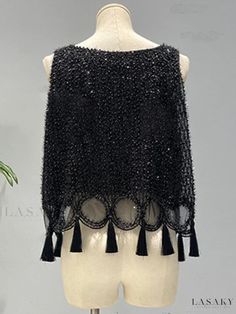 Millie Sleeveless Top with Tassel Details Spring Sleeveless Top With Beaded Fringe, Sleeveless Fringe Tank Top For Party, Party Fringe Sleeveless Tank Top, Party Fringe Tank Top, Sleeveless Party Tank Top With Fringe, Spring Party Tank Top With Fringe, Summer Sleeveless Tops With Beaded Fringe, Sleeveless Black Top With Fringe, Spring Sleeveless Vest With Tassels