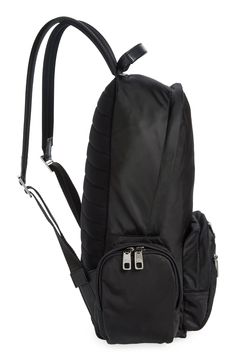 A sturdy design lends lasting durability to a pocket-packed backpack equipped with adjustable straps and a discreet ID slot. High-contrast logo lettering authenticates this practical style. Two-way top-zip closure Top carry handle; adjustable backpack straps Exterior zip pockets Interior slip pockets; interior zip pocket Lined Textile Made in Italy Designer Handbags Classic Black Backpack For Outdoors, Black Backpack With Adjustable Straps For Travel, Classic Nylon Backpack For Outdoor, Classic Nylon Backpack With Zipper Closure, Classic Nylon Bags For Outdoor, Classic Nylon Bag For Outdoor, Classic Nylon Backpack With Zipper Pocket, Black Functional Backpack With Adjustable Strap, Modern Black Backpack With Functional Pockets