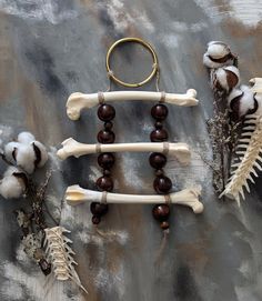 Mammal bone with large wooden beads wall hanging. Do not hang outside. * * * All bones are sanitized. All natural bits are scavenged or sourced from someone who found them. Bone Mobile, Beads Wall Hanging, Bone Decor, Witch Crafts, Leg Bones, Iris Art, Art Program, Bone Crafts