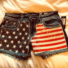 Size 28 Holiday Miss Me Shorts Casual High Waist Bottoms With American Flag Print, Casual High-waist Bottoms With American Flag Print, High Waist Bottoms With American Flag Print For Spring, Spring High Waist Bottoms With American Flag Print, American Flag Print Shorts For Spring, Casual High Rise Bottoms For 4th Of July, Casual High-rise Bottoms For 4th Of July, Blue Bottoms For 4th Of July, Short Length, Blue Short Length Bottoms For 4th Of July