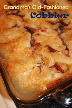 a close up of a casserole in a pan on a stove with words grandma's old - fashioned cobbler