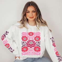 Get ready to turn heads and spread positive energy with our hippie style sweatshirt featuring a vibrant, eye-catching boho flower pattern on the front and on the sleeves. Designed for free spirits, this cozy sweater is a must-have for those who love to express their individuality. The colors of the design are berry, pink, red and some purple, the trendy colors for spring 2024! Perfect for those who appreciate the laid-back, carefree spirit of the 60s and 70s. Whether you're heading to a music fe Long Sleeve Graphic Print Hippie Top, White Crew Neck Hippie Top, Spring Bohemian Cotton Sweatshirt, White Bohemian Cotton Sweater, White Cotton Bohemian Sweater, Bohemian Cotton Sweater Relaxed Fit, Bohemian Long Sleeve Sweatshirt With Relaxed Fit, Bohemian Cotton Sweater With Relaxed Fit, Bohemian Relaxed Fit Cotton Sweater