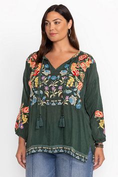 Embellished with bold floral embroidered detailing, the Zadonia Blouse is crafted from a lightweight and flowing fabric. Featuring a split V-neckline and gathers at the neck and shoulders, this blouse is finished with decorative tassels and bishop sleeves. Pair with linen trousers and mule sandals for a relaxed casual ensemble. Johnny Was Women's Zadonia Blouse in Rain Forest Green, Size 3XL, Linen, Floral Flowy V-neck Rayon Peasant Top, Green Embroidered V-neck Top, Peasant Blouse With Floral Embroidery And V-neck, Peasant V-neck Blouse With Floral Embroidery, Bohemian Peasant Top With Floral Embroidery V-neck, Bohemian Peasant Top With Floral Embroidery And V-neck, Floral Embroidered V-neck Peasant Top For Spring, Peasant V-neck Top With Floral Embroidery, Flowy Rayon V-neck Peasant Top