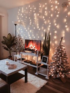 a living room decorated for christmas with lights on the wall