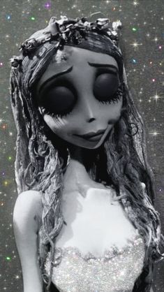 a close up of a doll wearing a dress and headband with stars in the background