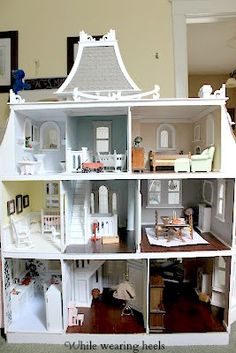 a doll house is shown with all the furniture in it's display case,