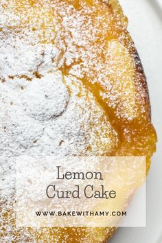 lemon curd cake on a white plate with powdered sugar over it and the words lemon curd cake above it