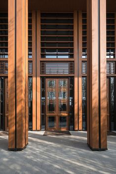 an entrance to a building with wooden slats