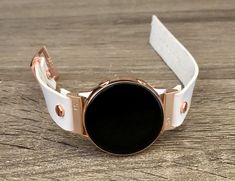 High Quality White Genuine Leather Strap Band Compatible with : Galaxy Watch (42mm) | Galaxy Watch Active | Watch Active2 (40mm) | Watch Active2 (44mm) | Adjustable Size Bracelet Perfectly Tailored to Fit Your Wrist. Designed And Handmade by Simeon D Jewelry. The Bracelet is Super Easy to Install on Your Watch. Comes with 4pcs 20mm Quick Release Pins. Please Measure Your Wrist Before Submitting Your Order! Samsung Watch Is NOT Included Create Your Own Unique Style! Be Different! Be Unique! Make Rose Gold Watch Bands As Gift, Rose Gold Bracelet Strap Watch Accessories, Rose Gold Round Bracelet Strap Watch Accessories, Rose Gold Round Watch With Bracelet Strap, Gold Watch Band, Gold Galaxy, Samsung Watch, Leather Rose, Rose Gold Bracelet