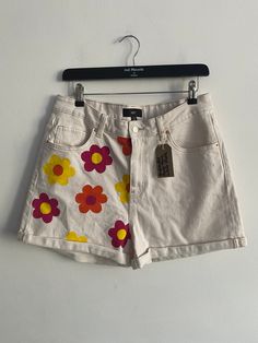 Hand painted vintage Levi shorts size uk 14 Vintage White Jean Shorts, Vintage White Jean Shorts For Spring, White Retro Shorts For Spring, Retro White Shorts For Spring, White Graphic Print Shorts, Graphic Print Spring Shorts, Vintage White Cotton Jean Shorts, Spring Graphic Print Shorts, White Cotton Vintage Jean Shorts