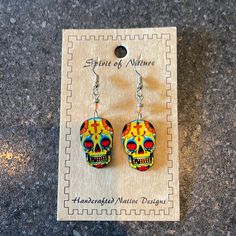 Nwt Spirit Of Nature Handcrafted Peruvian Pichincha Earrings Dia De Los Muertos Skull Earrings Hadecrafted In Peru. Surgical Steel Dangle Earrings With Yellow Glass Bead And Multi Colored Skull In Total 2 1/4" Long Skull Is 1 1/4" X 3/4" Skulls Are Made Of Lightweight Acrylic Back Of Skulls Are Black Novelty Yellow Earrings With Ear Wire, Yellow Novelty Earrings With Ear Wire, Handmade Yellow Novelty Jewelry, Yellow Handmade Novelty Jewelry, Handmade Multicolor Novelty Earrings, Artisan Yellow Earrings As Gift, Artisan Yellow Earrings For Gift, Handmade Earrings For Day Of The Dead, Yellow Festival Earrings With Matching Pair