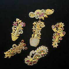 This beautiful jewelry can be used as two in one pc. It can be worn as a saree pin or can be used as a brooch. It is made in a Floral design, with a metal pin back system. Material: Semi-precious Ruby, emeralds, CZ. All the pins length: Length: 2 inches approx Width: 1 inches Saree Pins Brooches, Saree Pins, Saree Pin, Ruby Jewelry Necklaces, Fancy Sarees Party Wear, Wedding Brooch, Ruby Jewelry, Fancy Sarees, Metal Pins