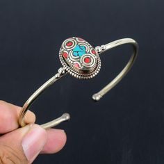 Turquoise With Red Coral Cuff Bracelet Tibetan Silver Cuff Bracelet Handmade Adjustable Bohemian Bangle Antique Nepali Jewelry Gift For Love SKU :- PT-795 Tibetan Cuff Bracelets Metal Purity :- Tibetan Silver Gemstone :- Turquoise, Coral Stone Color :- Green, Red Stone Shape :- Oval Cuff Bracelet Weight :- 31 Gram Cuff Bracelet Size :- Adjustable ########## * They are handmade and designed carefully by craftsmen * Different gemstones and brass parts brought together to create an elegant piece * Red Bohemian Cuff Bracelet As Gift, Bohemian Red Cuff Bracelet As Gift, Bohemian Style Red Cuff Bracelet As Gift, Turquoise Metal Cuff Bracelet As Gift, Turquoise Metal Cuff Bracelet Gift, Turquoise Metal Bangle As A Gift, Turquoise Metal Bangle As Gift, Turquoise Metal Bangle For Gift, Red Metal Cuff Bracelet Bangle