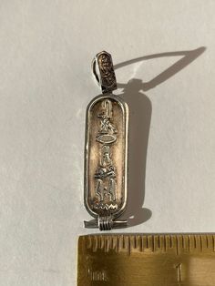 . I just love Egyptian Revival jewelry. Dramatic hieroglyphics sterling silver charm pendant. Would look so good with the ankh I have for sale. 2 inches high 1/2 inch wide 5.54 grams sterling silver Antique Ankh Collectible Jewelry, Vintage Silver Ankh Jewelry, Unique Silver Ankh Jewelry, Vintage Engraved Ankh Jewelry, Silver Ankh Jewelry, Egyptian Revival Jewelry, The Ankh, East Peoria, Egyptian Hieroglyphics