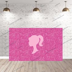 the silhouette of a woman's head on a pink background in front of a brick wall