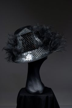 This piece is a real statement!! Glorious wide brim black parisisal hat with deconstructed crinoline around the whole hat apart from a statement mirror ball wedge! a slither of light, a ray of sunshine, a shard of fun!!  This piece is crazy fun, singing from the front, back and oh yes, the sides.  Very cool, on trend and super elegant! Perfect for a wedding or the races x Measurements: Brim side to side - 32  Crown - 10cm high, lined with Petersham ribbon Black Cloche Party Hat, Black Cloche Hat For Party, Black Cloche Hat With Short Brim For Party, Black Top Hat With Short Brim For Party, Party Top Hat With Short Brim In Black, Party Black Top Hat With Short Brim, Party Mini Hat With Wide Brim In Black, Evening Top Hat For Royal Ascot With Structured Crown, Black Wide Brim Mini Hat For Parties