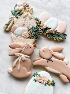 decorated cookies in the shape of bunnies and rabbits