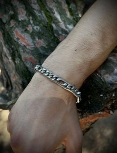 Featuring a unique cut-out design. This eye-catching bracelet combines traditional craftsmanship with modern flair, making it a perfect accessory for any occasion. ✦Item Details ➥ Material: 925K Sterling Silver ➥ Chain Length For Bracelet Use: (Select Variation) -7 Inch (18 Cm) -8 Inch (20 Cm) -9 Inch (23 Cm) ➥Please Contact me for specific lengths or add a note ➥ Weight: 44 Grams (In Average) ➥ Ready to Ship in 1-2 Business Days In Usual ✈✈Free UPS Express Shipping (2-4 Business Days) ✈✈ ♻️Recycled Eco-Friendly Quality Packaging♻️ ♻️DerGrünePunkt Registered Eco-Friendly Business♻️ ★★30% OFF WHEN YOU BUY 2 ITEMS★★ ★★40% OFF WHEN YOU BUY 3 ITEMS★★ ----------------------------------------------------------- Silver, a currency used for millennia, maintains its value, while craftsmanship, incr Modern Engraved Link Chain Bracelet, Modern Engraved Sterling Silver Chain Bracelet, Adjustable Silver Bracelet With Figaro Chain, Adjustable Silver Figaro Chain Bracelet, Modern Silver Bracelet With Figaro Chain, Silver Figaro Chain Bracelet As Gift, Modern Figaro Chain Bracelet As Gift, Bracelet For Men, Cut Out Design