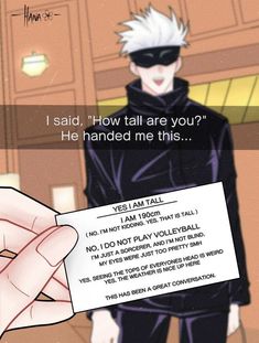 a person holding up a piece of paper with an anime character in the back ground