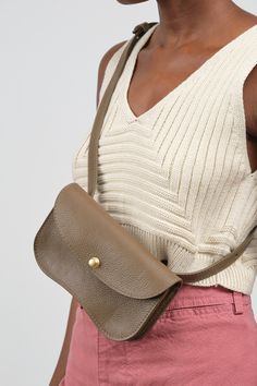 The Faba Bag in Otter is a versatile and stylish, neutral shade pouch, that's perfect for elevating your everyday look. With an internal divider and a pocket for credit cards, this bag is secured with a sleek brass pinch and pull release closure. Wear it as a clutch or use the adjustable strap for crossbody or over the shoulder wear. Modern Taupe Shoulder Bag For Everyday Use, Versatile Belt Bag For On-the-go, Modern Taupe Shoulder Bag For Everyday, Versatile Everyday Clutch Flap Bag, Modern Taupe Bag For Everyday Use, Taupe Crossbody Satchel For Everyday Use, Beige Pouch Belt Bag With Detachable Strap, Classic Taupe Shoulder Bag For Everyday, Modern Taupe Satchel For Everyday