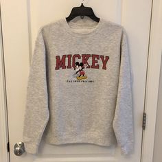 Nwot Crewneck Sweatshirt Has Fluffy Fleece Inside It That Keeps You Nice And Warm! Has Mickey Mouse Sewed On The Center Of The Sweatshirt With A Cute Printed “Mickey” Writing On Top Of Mickey Mouse Animation. I Have Other Cute Crewneck That Are Different Colors If You Would Like To Bundle! Size M But Works As An Oversized S, If You Prefer That!! It Is One Piece, But I Have It Under S And M Categories So It Shows Up As Oversized Or Regular Fit. Measurement From Armpit To Armpit Is 22 Inches Measu Sporty Mickey Mouse Crew Neck Top, Disney Letter Print Sweatshirt For Winter, Casual Mickey Mouse Crew Neck Sweatshirt, Casual Crew Neck Mickey Mouse Sweatshirt, Fall Mickey Mouse Crew Neck Sweatshirt, Casual Long Sleeve Mickey Mouse Sweatshirt, Casual Mickey Mouse Tops For Winter, Casual Cotton Mickey Mouse Sweatshirt, Casual Mickey Mouse Tops For Loungewear