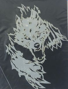 an image of a wolf on the side of a car window with white outlines