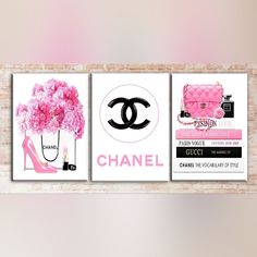 two chanel posters on a brick wall with pink flowers and high heeled shoes