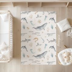 an overhead view of a baby's room with dolphin and sea animals on the wall