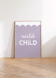 a purple poster with the words wild child on it in front of a white wall