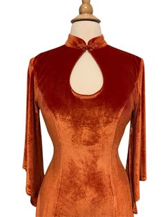 This Product Listing is for a PreOrder Item, Estimated Ship date is first week of September 2022. Made of soft and stretchy velvet, featuring a 1970s boho style knot button collar and kimono sleeves, the Willow dress gives us whimsical comfort in a classic 1970s cut. color: Pumpkin Orange, most accurately shown in our mannequin photos, the photography lights may brighten or alter the fabric color. Waist to Hem est. 40" Fit, 3-4 Inch of stretch (High stretch velvet) If you fall between sizes, or Orange Velvet Dress Casual, Orange Velvet Dress Short, Mustard Velvet Dress Short, Willow Dress, Knot Button, Kimono Sleeves, September 2022, Product Listing, Stretch Velvet