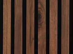 wood slats are lined up against a black background in this close - up photo