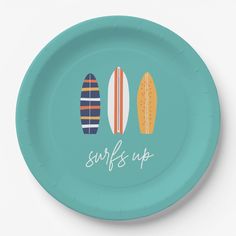 a paper plate with two surfboards and the words surf's up on it