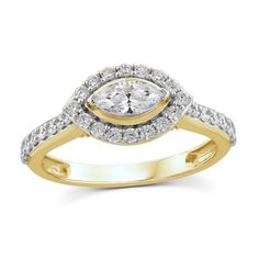 a yellow and white gold ring with an oval cut diamond surrounded by small round diamonds