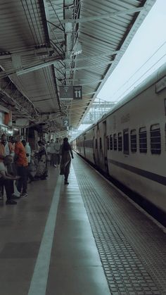 people are waiting for the train to arrive