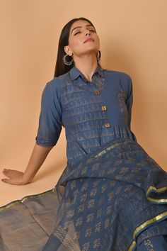 Crafted with the finest Indian cotton, this exquisite dress is a celebration of traditional craftsmanship and contemporary style. Each intricate block print design is a testament to the rich heritage of Indian textiles, specifically hailing from the colorful region of Rajasthan. The lightweight and breathable cotton fabric make this dress a perfect choice for warm summer days, ensuring both comfort and style in one elegant piece. The Jaipuri print adorning the dress brings alive the vibrant colors and floral patterns that are characteristic of this culturally rich region. This stunning cotton dress is more than just clothing; it's a statement piece that bridges the gap between tradition and modern fashion. Whether you're looking for a standout ensemble to gift your girlfriend, mom, sister, Blue Cotton Kurta With Zari Work, Cotton Block Print Dresses For Festive, Cotton Block Print Dress For Festive Occasions, Blue Straight Kurta Dress With Printed Motifs, Traditional Blue Block Print Sets, Blue Cotton Anarkali Set With Zari Work, Traditional Indigo Dress For Festive Season, Traditional Indigo Dress For Festive Occasions, Blue Sets With Printed Motifs For Transitional Season