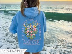 Trendy oversized Christian merch hoodie with Bible verse text and boho floral graphic on the back.  Graphic is made using direct to garment printing so you'll never have to worry about cracking or peeling images.  Available in Sand, White, Carolina Blue & Pink. Graphic is printed on the back. Unisex Gildan 18500 hoodie. Fits true to size. Size up for an oversized look.  - The tear-away label  - Made with a medium-heavy fabric blend of 50% cotton and 50% polyester - Fabric blends: Heather Sport c Cute Sweatshirts Christian, Cute Christian Sweatshirts, Bible Merch, Trending Sweatshirts, Christen Sweatshirts, Bible Verse Hoodies, Bible Hoodies, Jesus Hoodies, Jesus Sweatshirts Hoodies