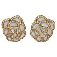 VAN CLEEF & ARPELS Diamond, Mother of Pearl Flower Earrings A pair of 18k yellow gold flower motif ear clips, set with diamonds and mother of pearl, signed Van Cleef & Arpels. dimensions approx. 1.25″ in length by 1″ by width Signed "VAN CLEEF & ARPELS"; circa 1980s Gold Vans, Van Cleef & Arpels, Mother Of Pearl Earrings, Van Cleef And Arpels, Pearl And Diamond Earrings, Van Cleef, Van Cleef Arpels, Pearl Flower, Diamond Flower