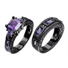 two black gold rings with purple cubicles on the sides and an intricate design in the middle