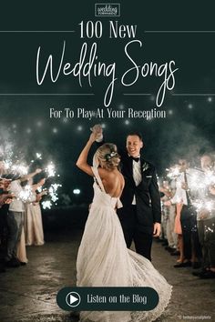 a bride and groom dancing with sparklers in the background