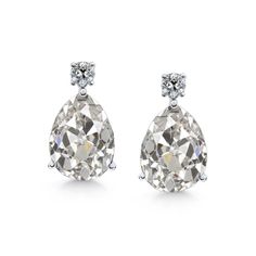 METAL SPECIFICATIONS White Gold 14K STONE SPECIFICATIONS Stone Name : Old Miner Stone Cut : Pear and Round Stone Details : There is one pear old miner diamond approx. 2 carats (Approx. Size 8.5 x 7 mm) and approx. 0.25 carats of smaller diamonds in each earring. Natural earth mined diamonds. Approx. Age of Diamonds : Over a Billion years old Place of Formation : At depths between 93 to 155 miles in the Earth mantle Color : F/G Clarity : VS1 Total : Approx. 4.50 Carats EARRING SPECIFICATIONS Over Classic White Gold Teardrop Earrings With Prong Setting, Classic White Pear-shaped Teardrop Earrings, Classic White Gold Pear-shaped Bridal Earrings, Classic Teardrop Earrings In Brilliant Cut, Classic Pear-shaped Teardrop Earrings In Brilliant Cut, Classic Pear-shaped Teardrop Earrings With Brilliant Cut, Classic White Teardrop Earrings With Diamond Accents, Classic Pear-shaped Diamond White Bridal Earrings, Classic White Gold Teardrop Earrings With Diamond Cut