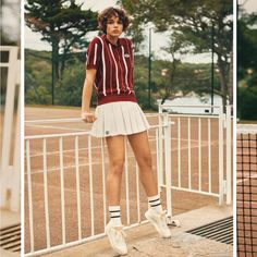 a woman standing on top of a tennis court