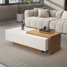 a living room with a white couch and coffee table