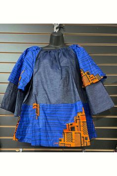 Suitable for sizes ranging from extra small to 3X, this top is expertly crafted with African print and denim for a unique and stylish look. Imported for quality and authenticity. Print Denim, Printed Denim, Top Sales, Denim Top, African Print, Blue Orange, Blue Gold, Top Blouse, Boutique