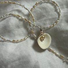 Pretty Pearl Shell Necklace Designed By @Wyndemere_tides On Ig, Minimal Design, Stackable Design Simple Shell Necklace, Handmade Elegant Pearl White Shell Necklace, Elegant Adjustable Shell Pearl Necklace, Elegant Handmade Silver Shell Necklace, White Shell Necklace, Adjustable, Wedding Necklace Pearl, Bohemian Shell-shaped Pearl Necklace, Pearl Necklace Wedding, Dream Aesthetic