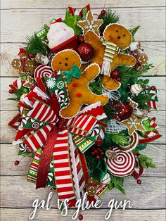 a christmas wreath with gingerbreads and candy canes