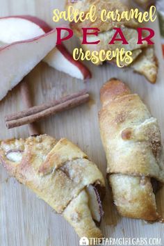 apples and cinnamon pear croissants are on a cutting board with cinnamon sticks