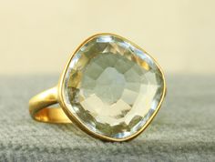 This is a great modernist artisan Ring.  It is Green Amethyst in a rich 14K surround.  It sports a 8+ CT pale Green Stone just right for Spring.  It weighs 4.4 grams in size 6.25.  In excellent estate condition. Formal Gold Amethyst Ring With Green Stone, Formal Green Amethyst Ring In Gold, Gold Green Amethyst Ring For Formal Occasions, Formal Gold Green Amethyst Ring, Modern Gold Amethyst Ring, Gold Amethyst Ring With Large Stone As Gift, Modern Yellow Gold Amethyst Ring For Wedding, Modern Yellow Gold Amethyst Wedding Ring, Modern Gold Amethyst Gemstone Ring