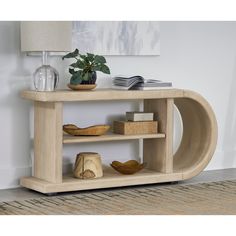 a wooden shelf with books and vases on it